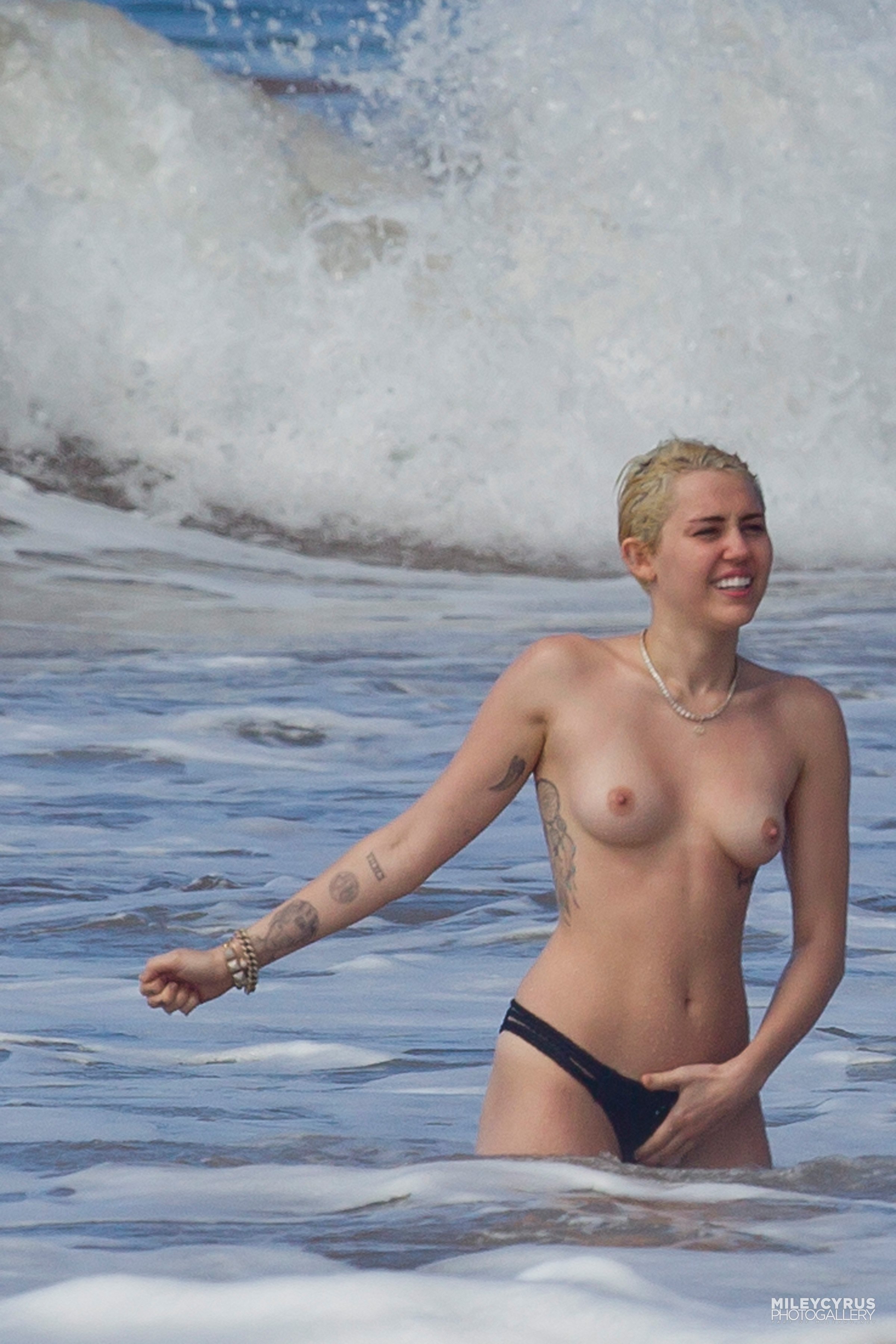 adam langer share miley cyrus topless beach photos