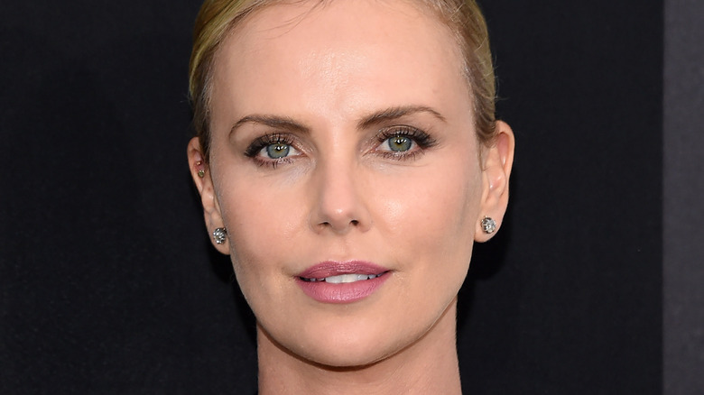adan solis recommends how tall is charlize theron in feet pic