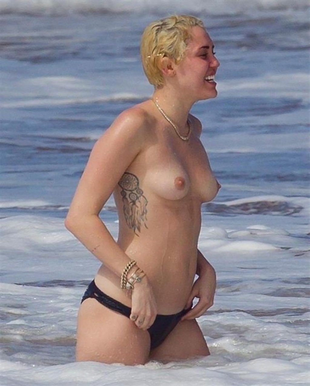 alex rossouw recommends miley cyrus topless beach pic