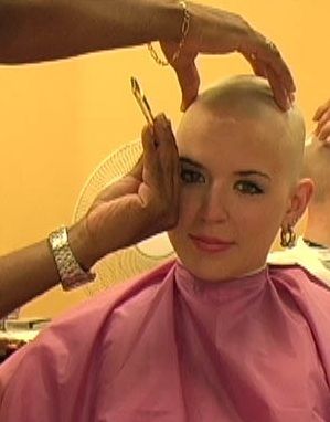 woman headshave in barbershop