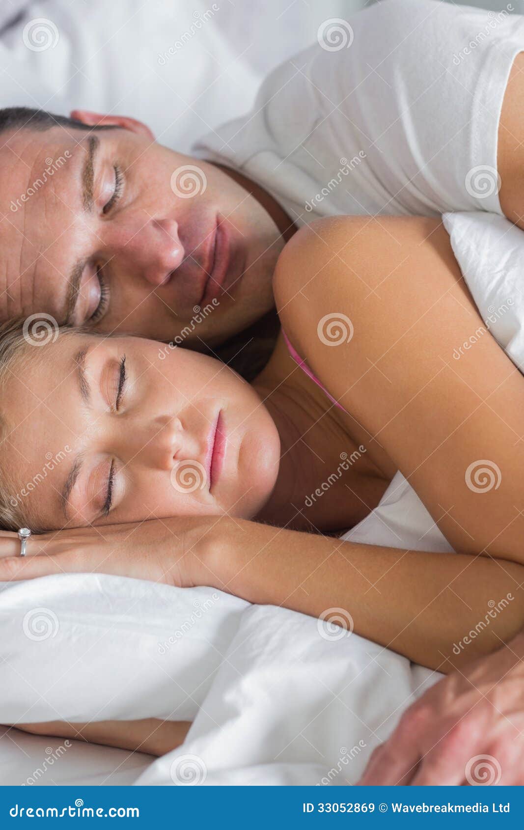 brian carrihill add couples spooning in bed photo