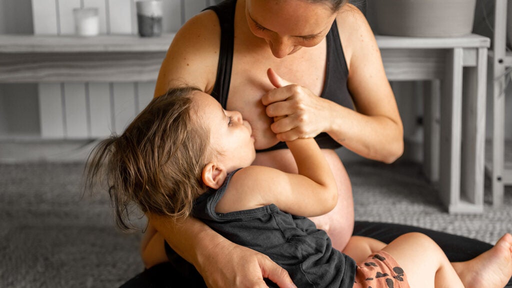 mom breastfeeding adult son